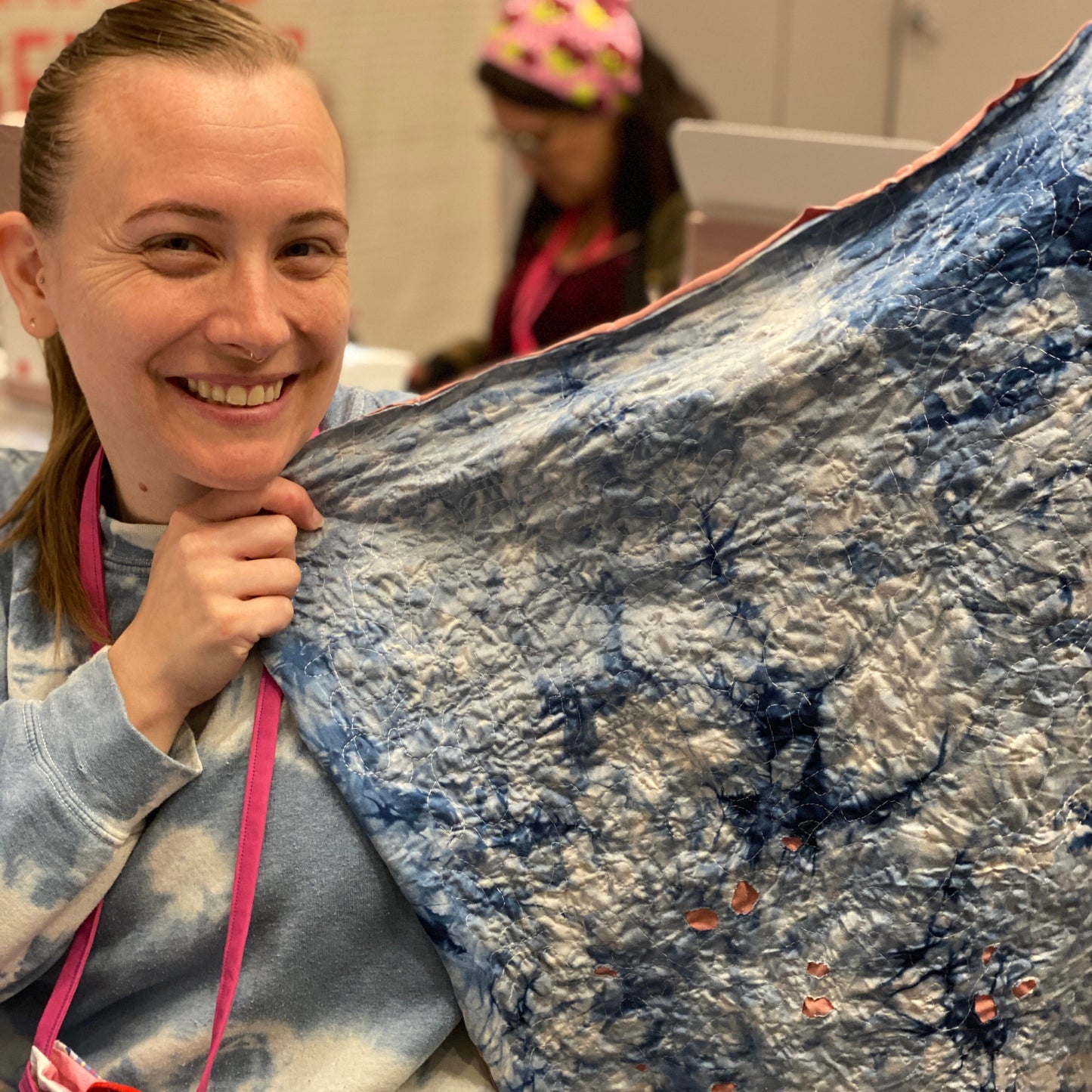 A student working on their reverse applique bandana project.