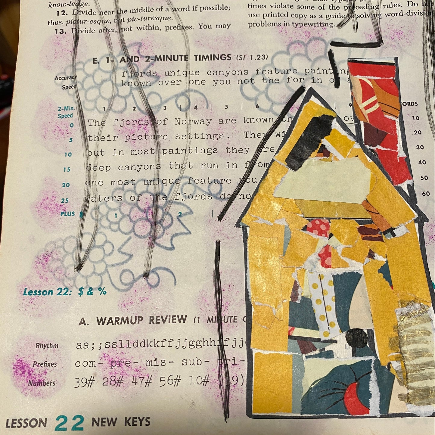 An art journal page that has some grapes ironed on from an embroider pattern. In the lower right corner, there is a yellow house with a red chimney that was made from torn bits of paper.