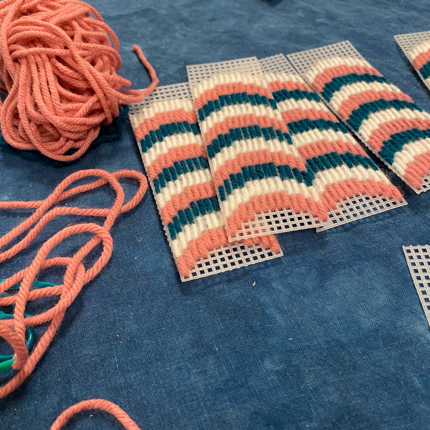 A needlepoint project on plastic canvas in progress.