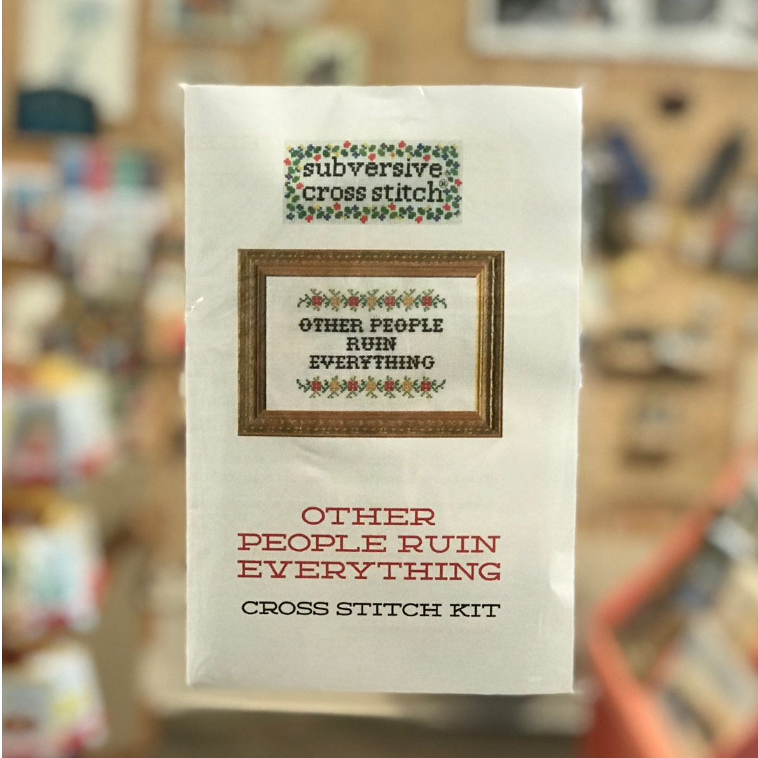 Packaged cross stitch kit that says "Other People Ruin Everything" by Subversive Cross Stitch.