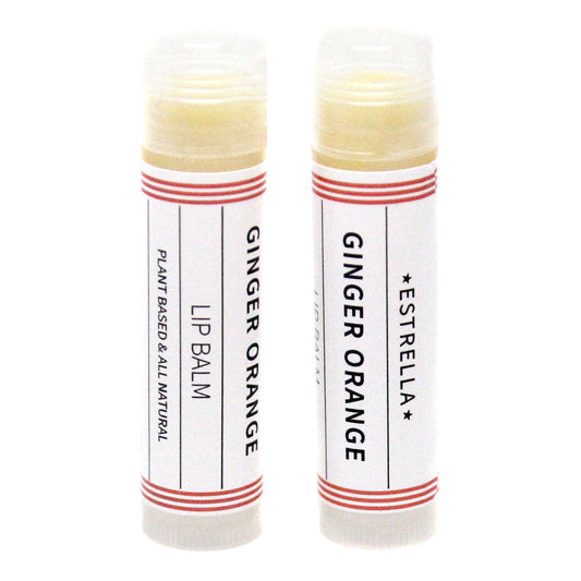 Two Estrella Ginger Orange handmade lipbalms. The label says theya re plant based and all natural.