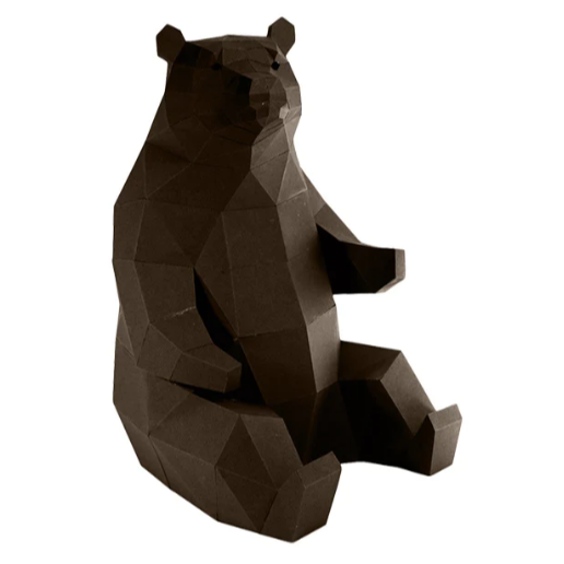 An example of a completed paper craft kit of a bear sitting down against a white background.