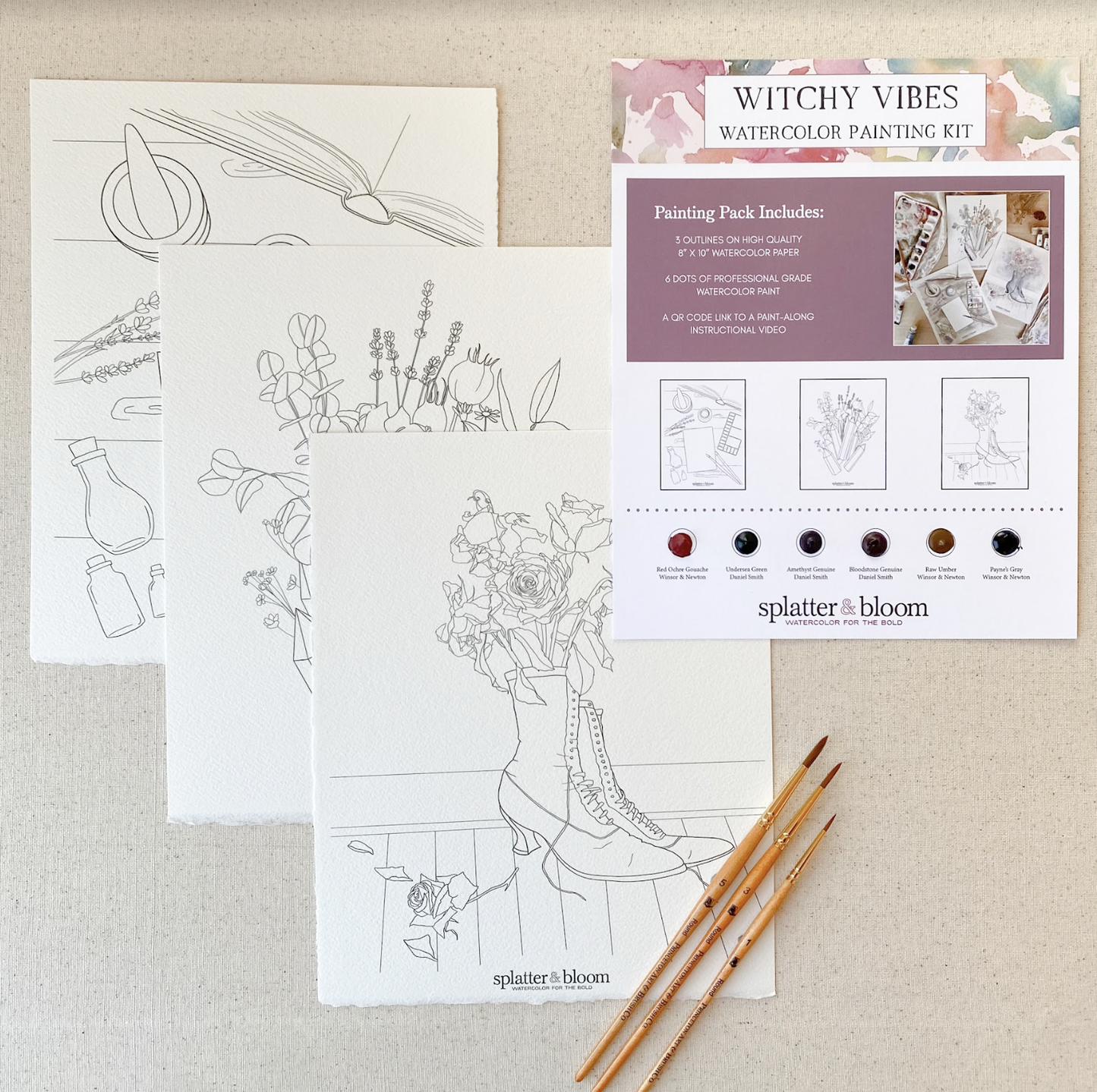 Three images printed on watercolor paper are ready to be painted. One is a witches boot with flowers growing out of it. The set is called Witchy Vibes.