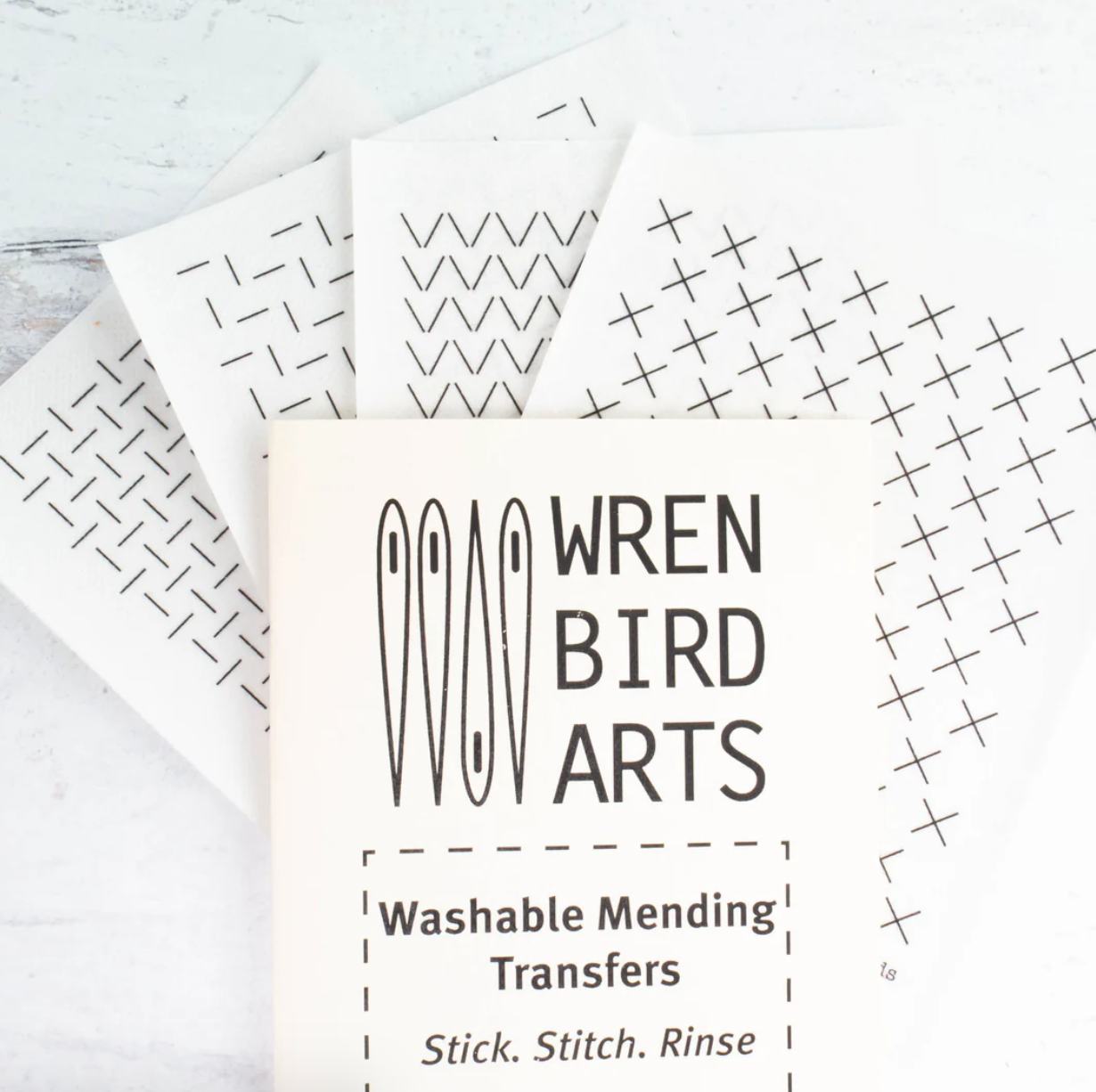An example of each of the four washable mending transfer sheets is shown. 