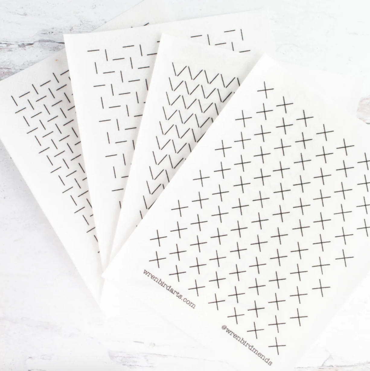 An example of each of the four washable mending transfer sheets is shown. 