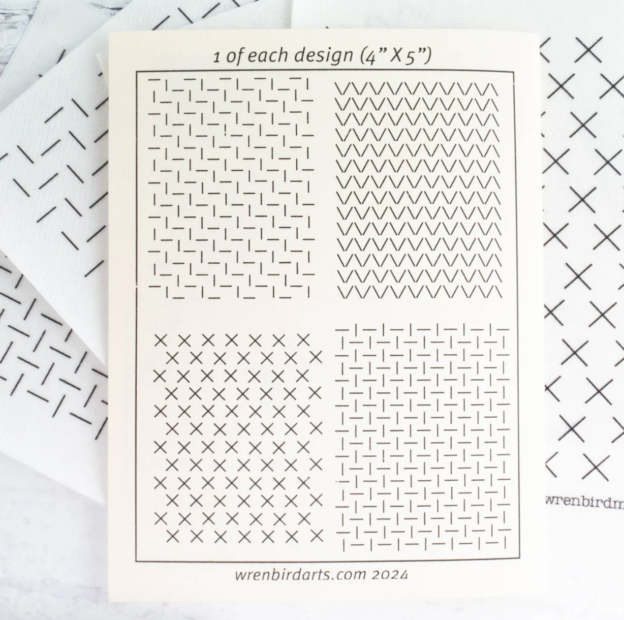 An example of each of the four washable mending transfer sheets is shown. 