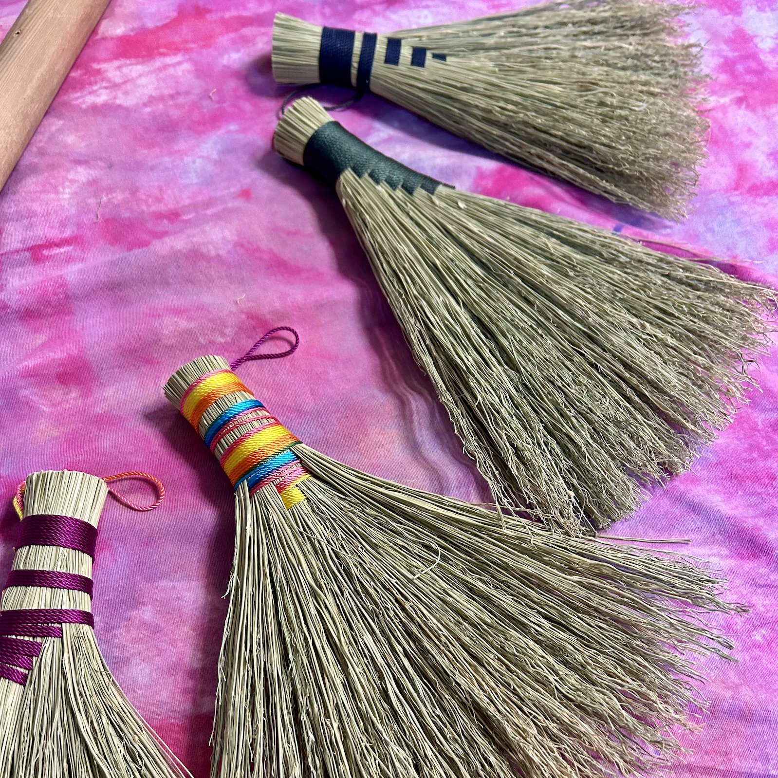 Four examples of hand brooms.