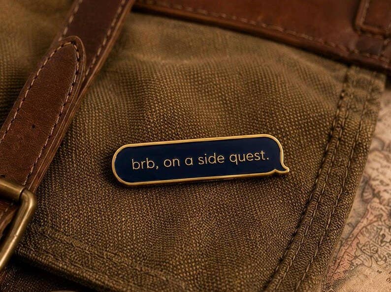 Side Quest Enamel Pin Navy Blue Gold Text Message Pin for Gamers and Book Lovers