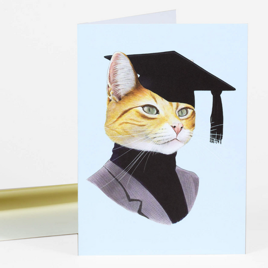 A greeting card with a smart orange cat on the front. They are wearing a graduation cap. They are also wearing a black turtleneck and a gray blazer. 