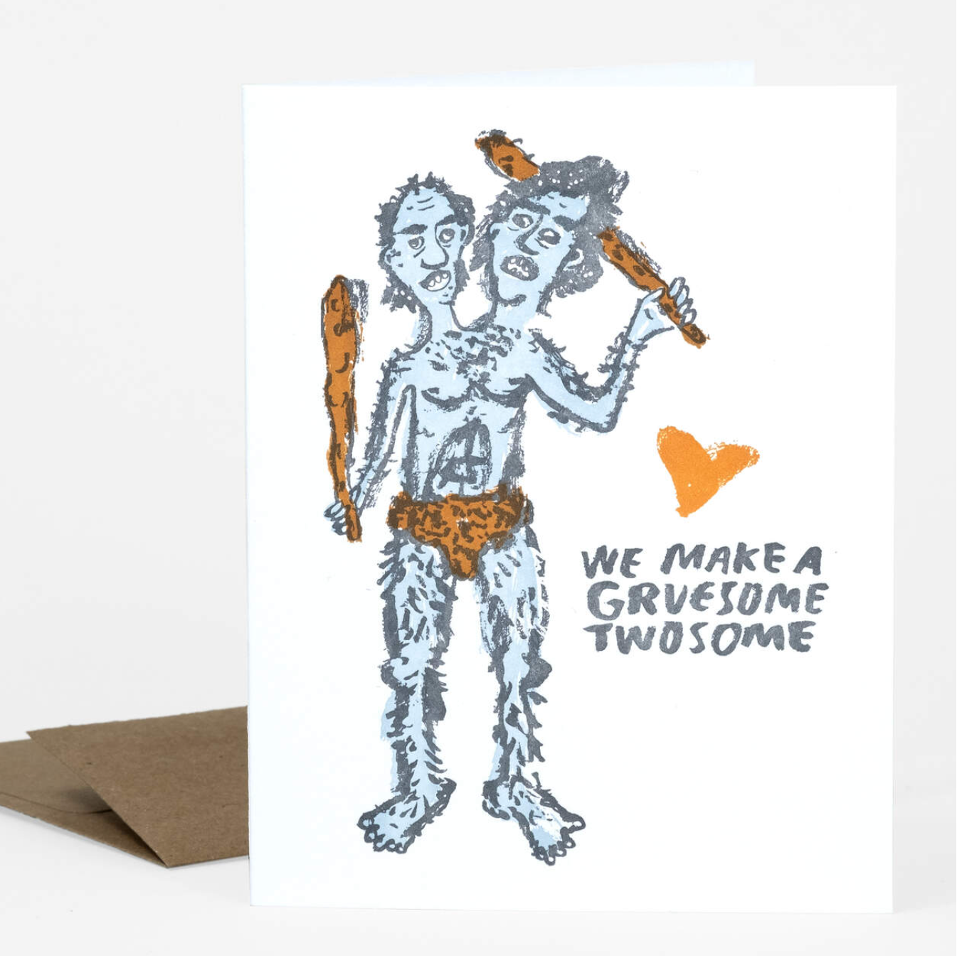 This letterpress greeting card has a two-headed person with a club in each hand. They are very hairy and are wearing a loin cloth. It says "We make a gruesome twosome."