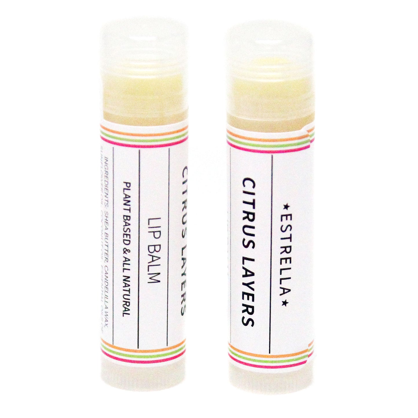 Two sticks of Estrella lip balm with citrus layers, one standing upright and the other lying down, both with colorful labels.