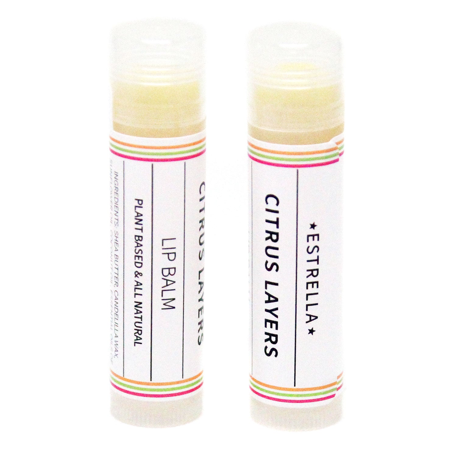 Two sticks of Estrella lip balm with citrus layers, one standing upright and the other lying down, both with colorful labels.